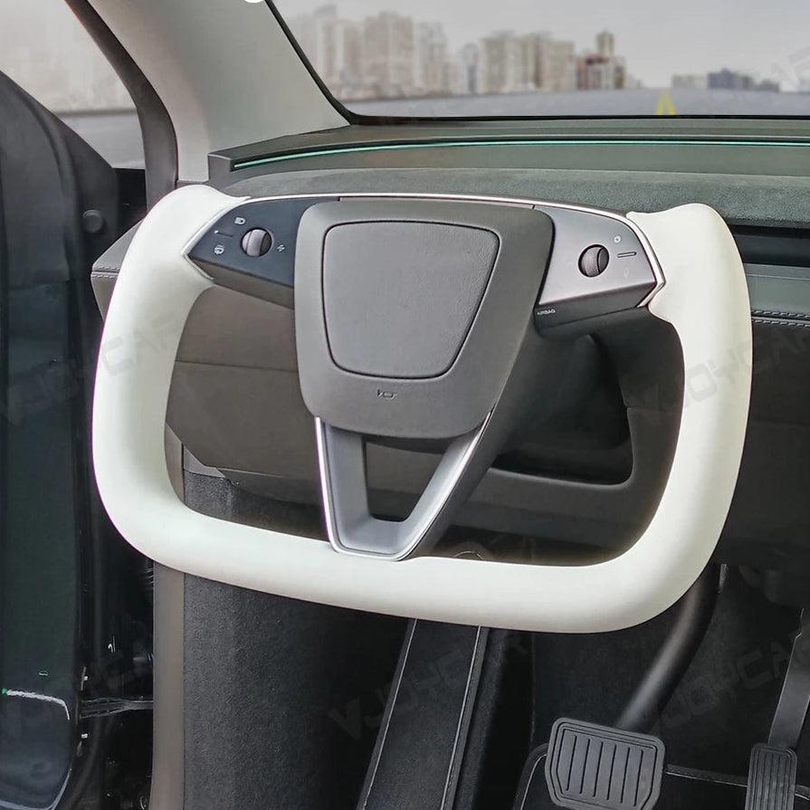 White heated yoke steering wheel for Tesla Model Y 2025 Juniper, premium leather racing style handle installed in vehicle interior.