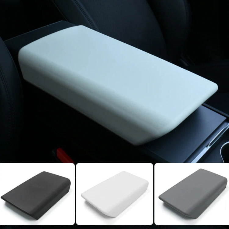White armrest cover pad installed on the Tesla Model Y center console, with additional color options in black, white, and gray.