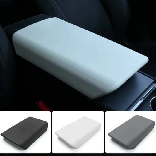 White armrest cover pad installed on the Tesla Model Y center console, with additional color options in black, white, and gray.